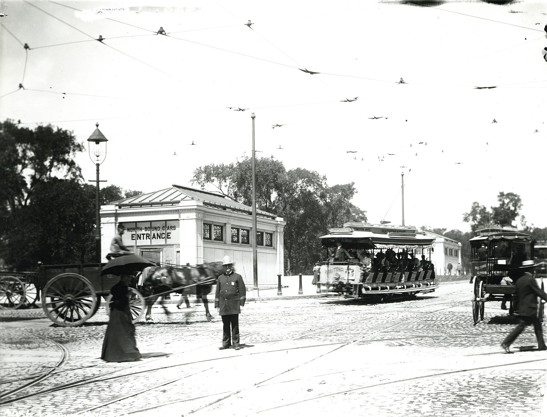 Open streetcars and the Boylston subway station entrance on Tremont Street, 1897